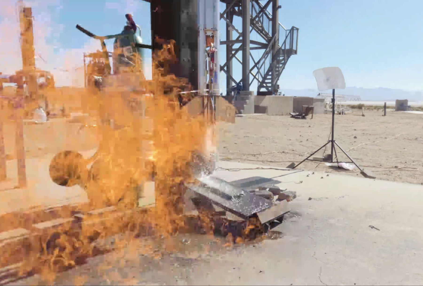 TANGERINE's second static fire sends flame across the pad beside the test gantry