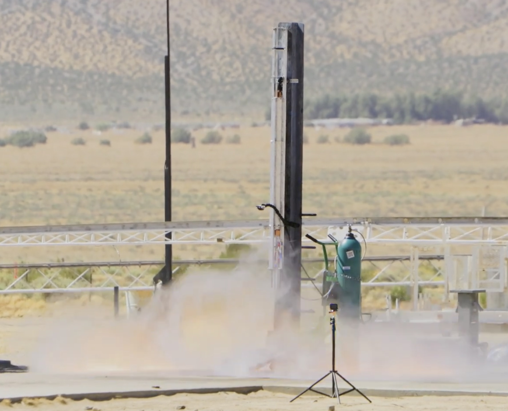 TANGERINE firing on its vertical test stand in the desert